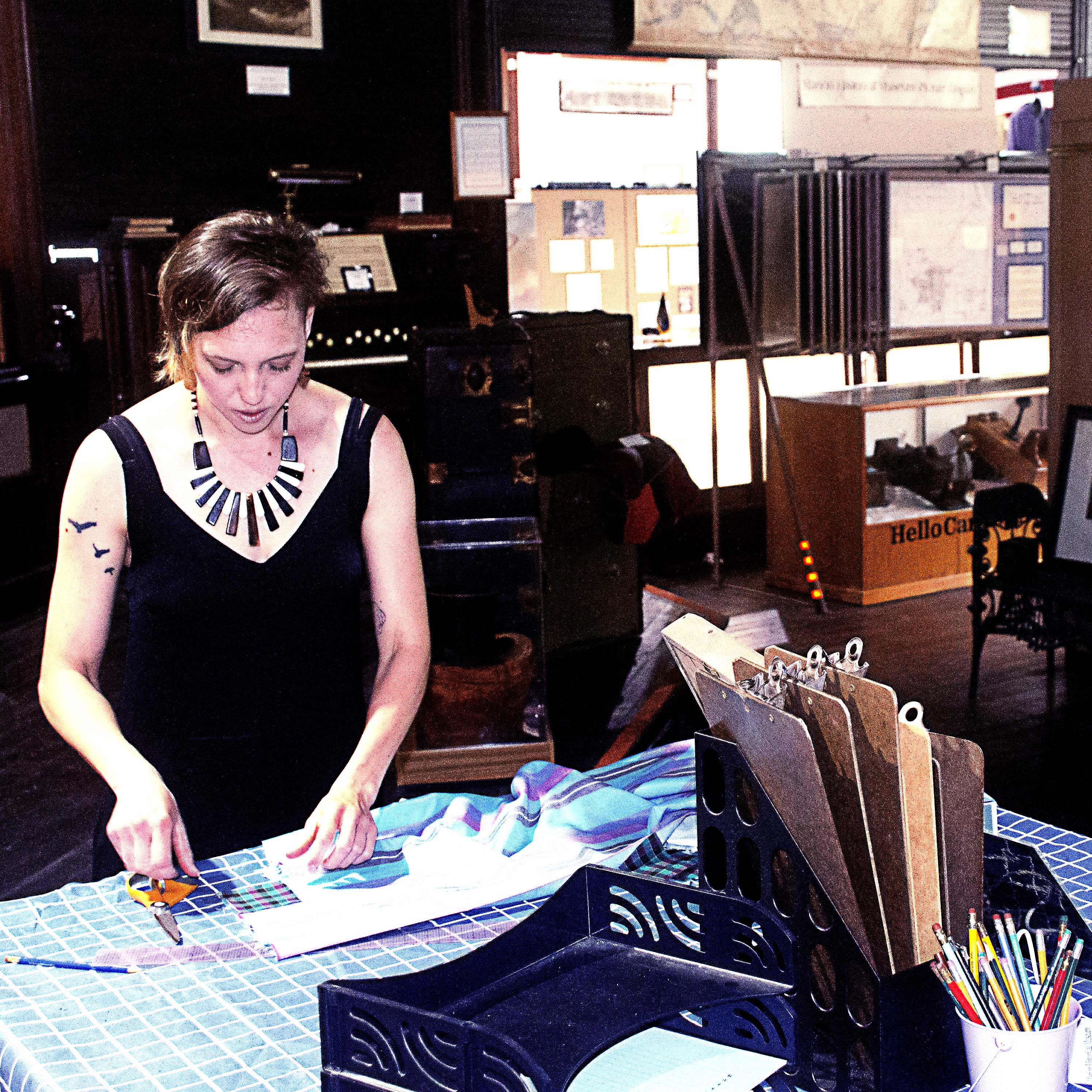 Alecia Stuchlik works on what will be an arts and crafts table for local kids.